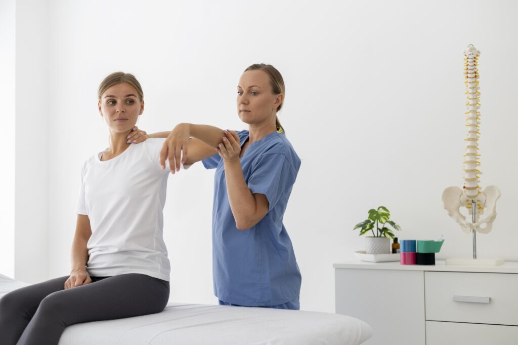 physiotherapist-helping-young-female-patient-her-clinic